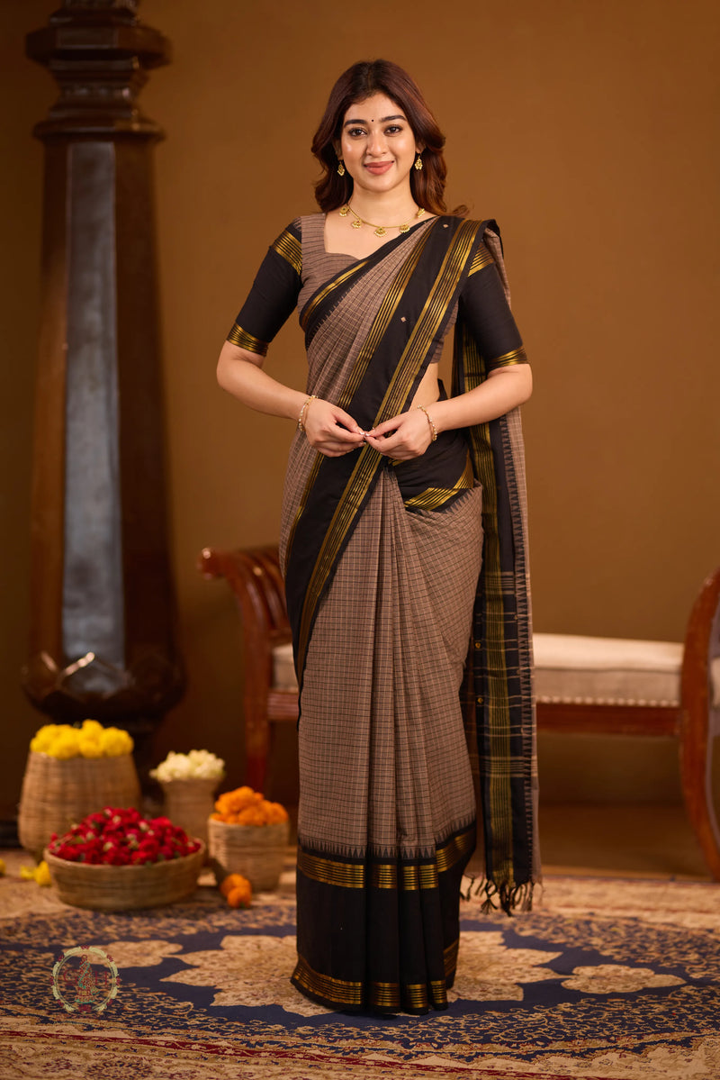 Warm brown with black border and golden zari detailing